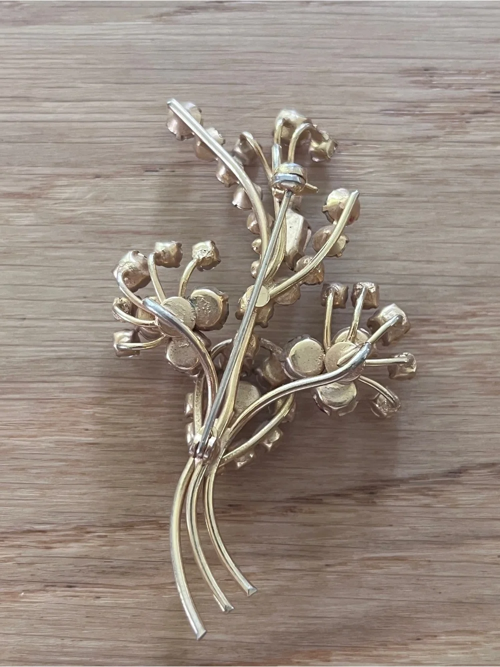 Vintage Gold-Tone Floral Brooch with Ruby Red and Clear Rhinestones